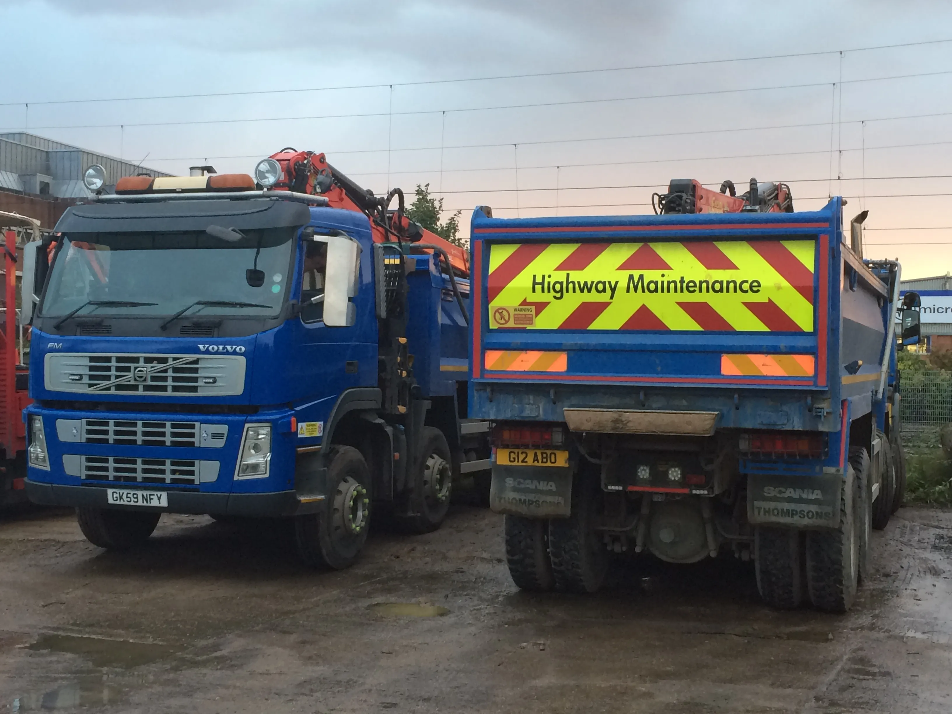 a couple of trucks parked next to each other